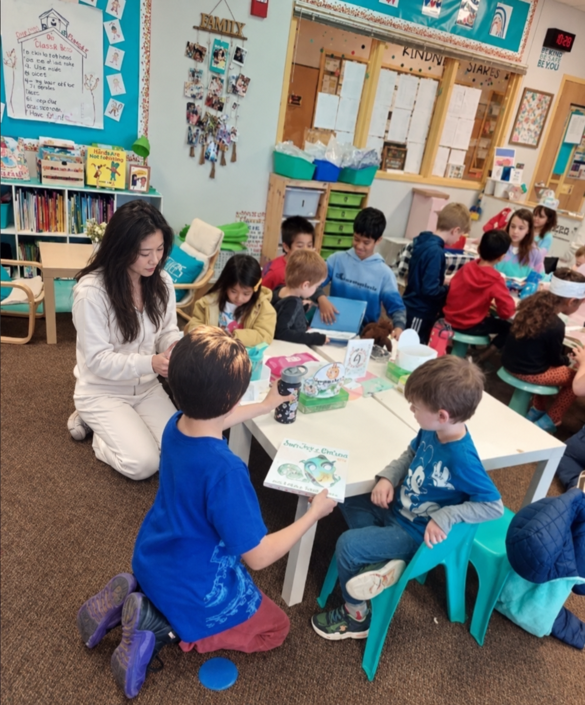 Anna Cheung spending time with children in an educational setting